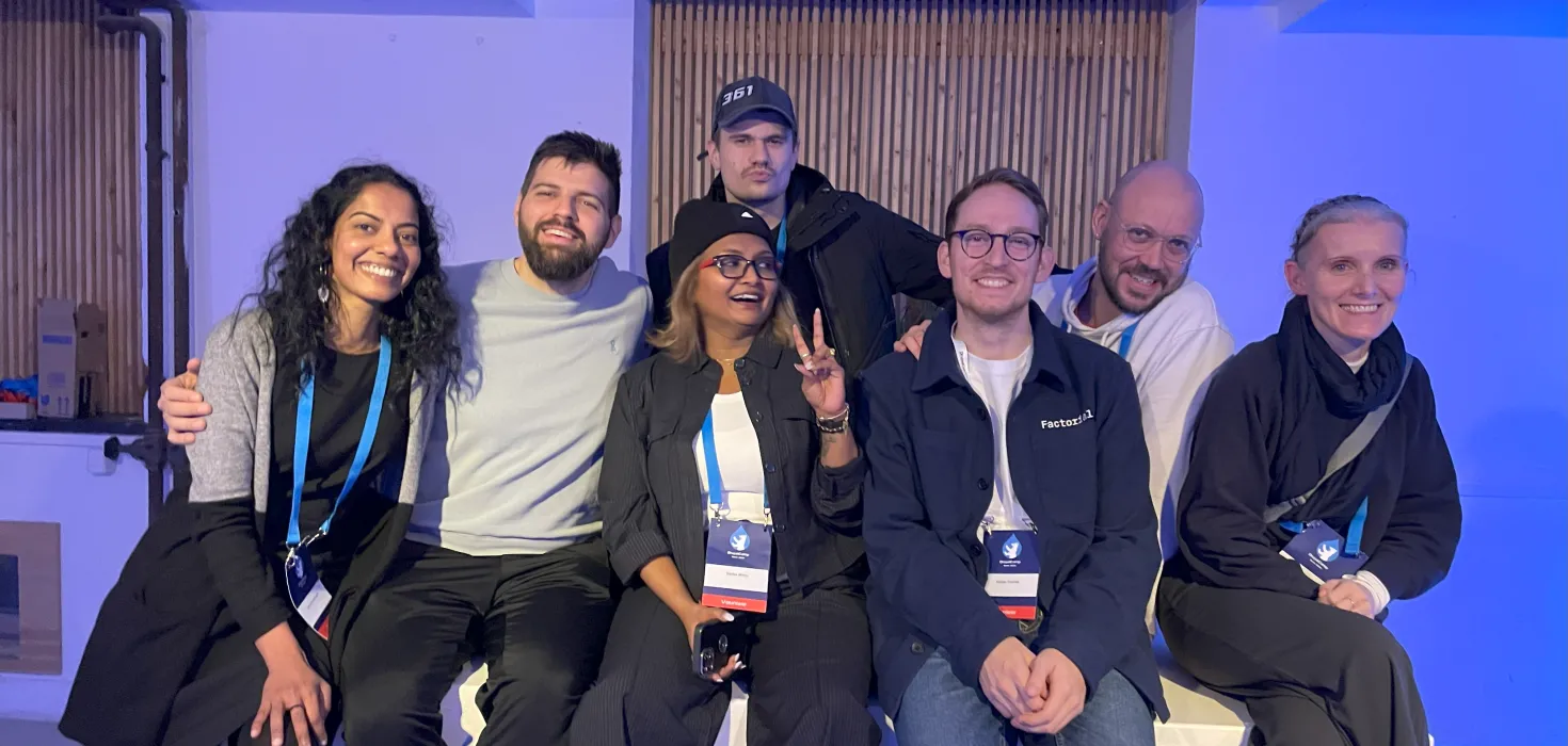 Small group of DrupalCamp Berlin attendees with their passes
