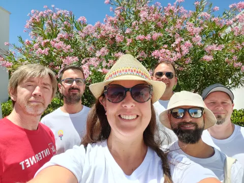 The “Adelfa” team with oleander blossoms behind