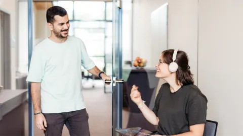 Alberto greeting Karen at the office