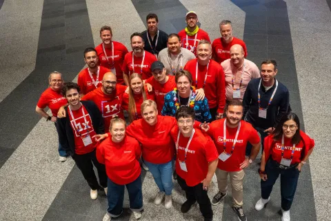 1xTEAM wearing branded T-shirts attending the conference