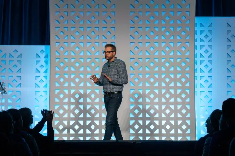 Dries Buytaert standing on the stage at DrupalCon Chicago 2026
